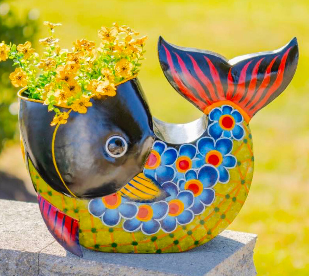 A colorful fish themed planter.