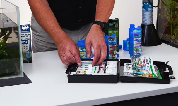 A fishkeeper laying out their tools to begin maintenance.