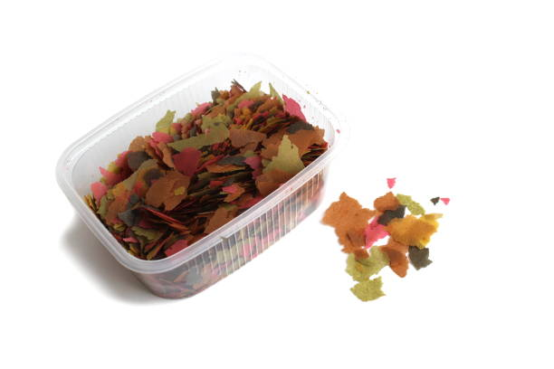 Pictured, flakes for feeding fish