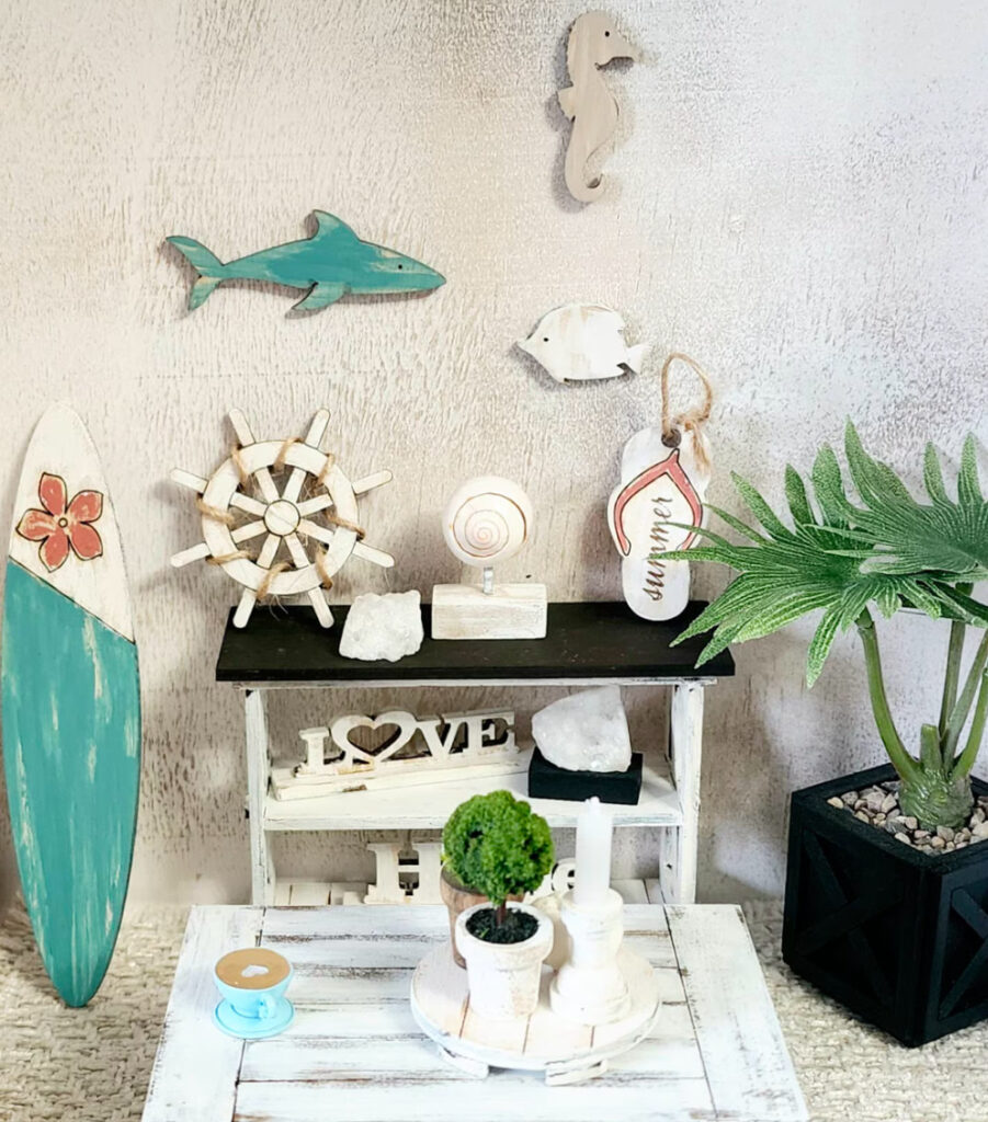 A nautical themed room with a surf board, pirate ship wheel, and ocean creature wall decor.